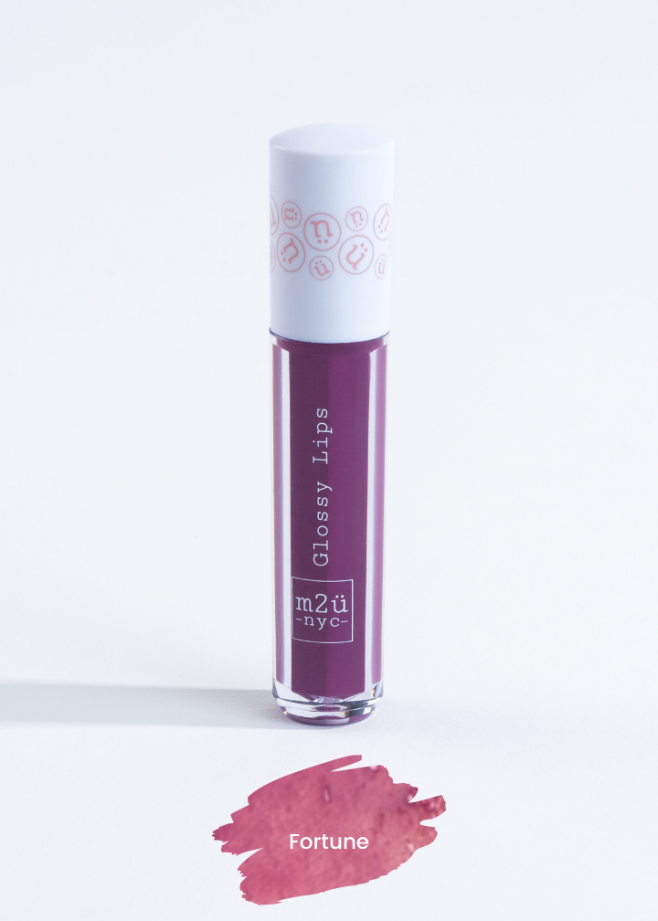 lip gloss in shade "Fortune" (purple)
