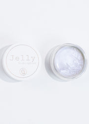 an open jar of the iridescent jelly highlighter, vegan and cruelty free