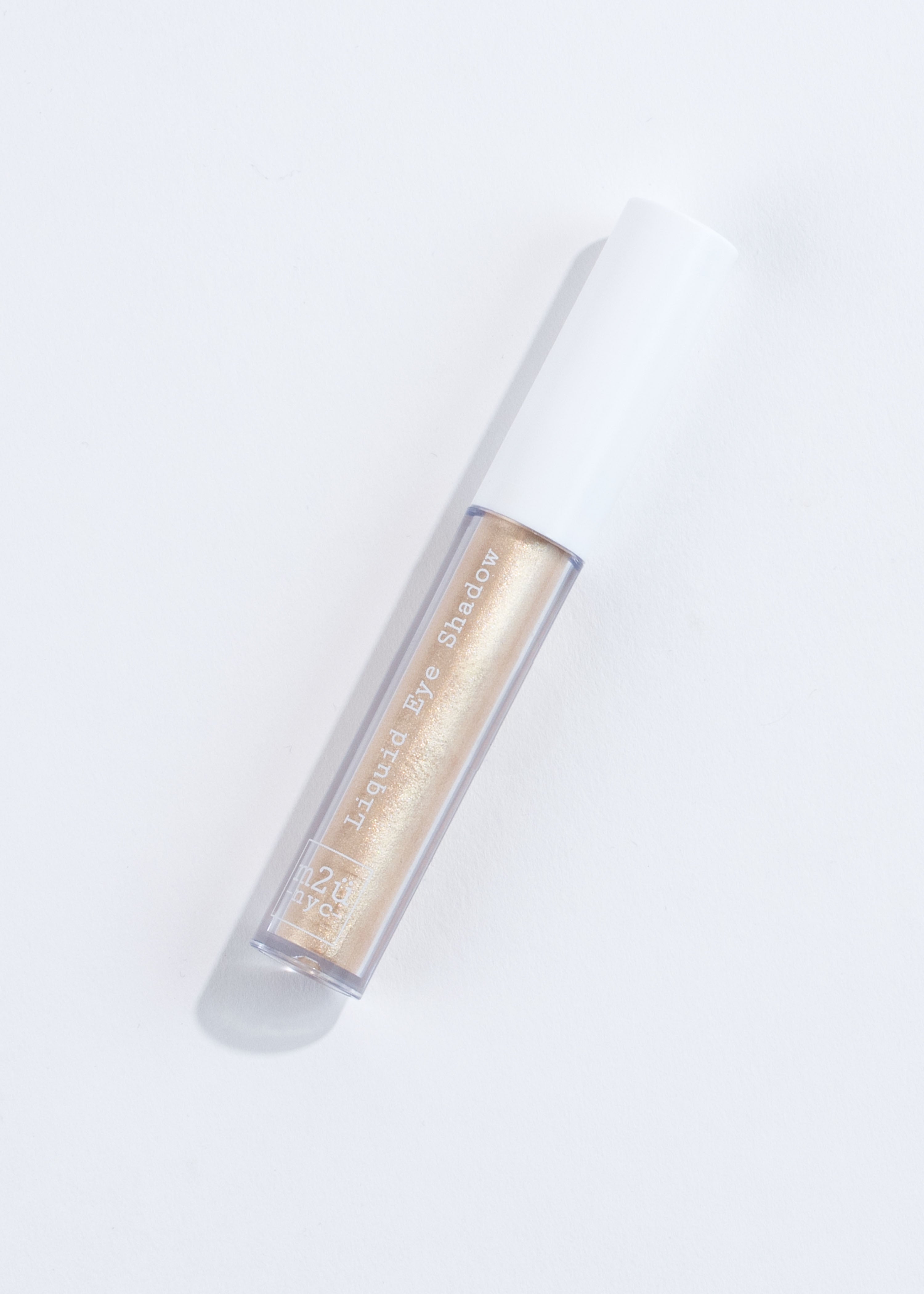 a bottle of liquid eyeshadow in shade prince- gold